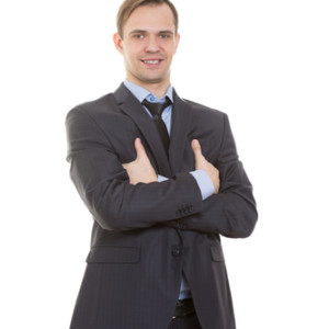 body language. man in business suit isolated white background. gestures of arms and hands. posture of superiority. emphasis thumbs. crossed arms